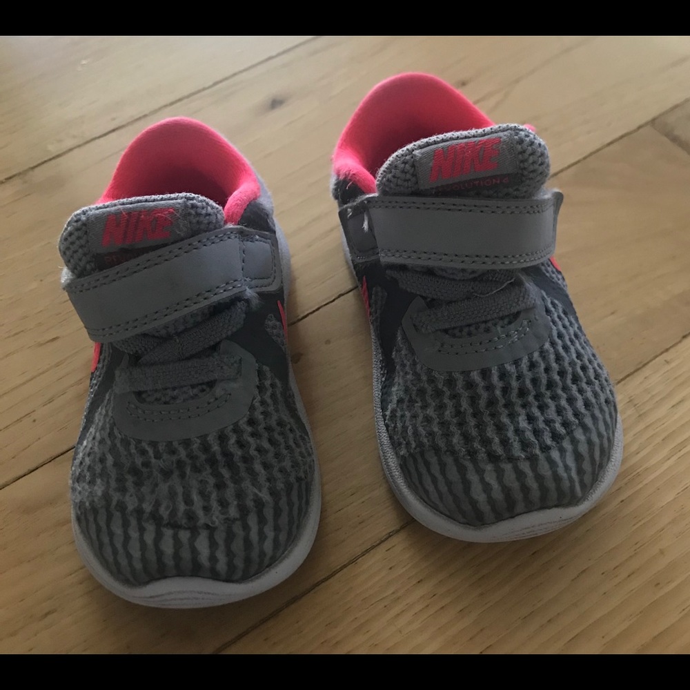 Gray and Pink Nike shoes